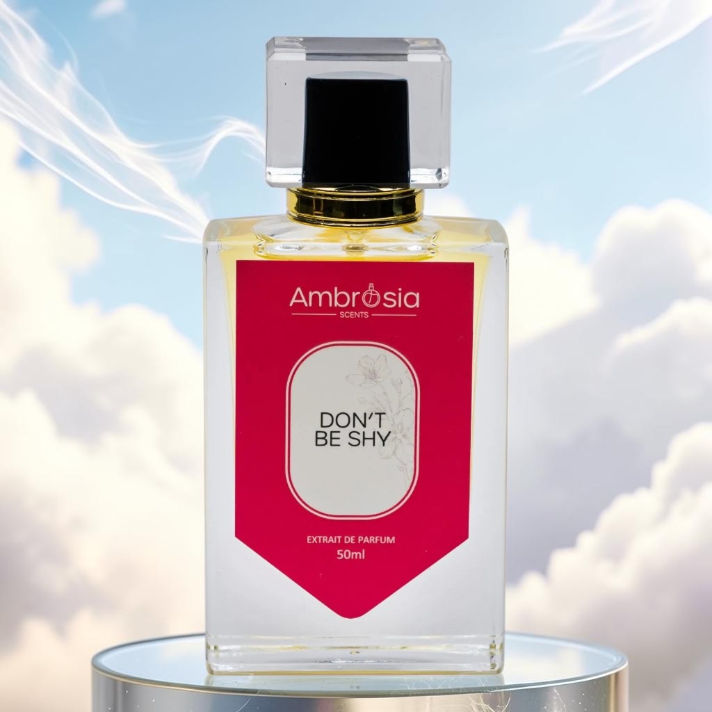 Ambrosia Scents Don't Be Shy Extrait De Parfum, a floral and gourmand fragrance with notes of rose, jasmine, vanilla, and caramel.
