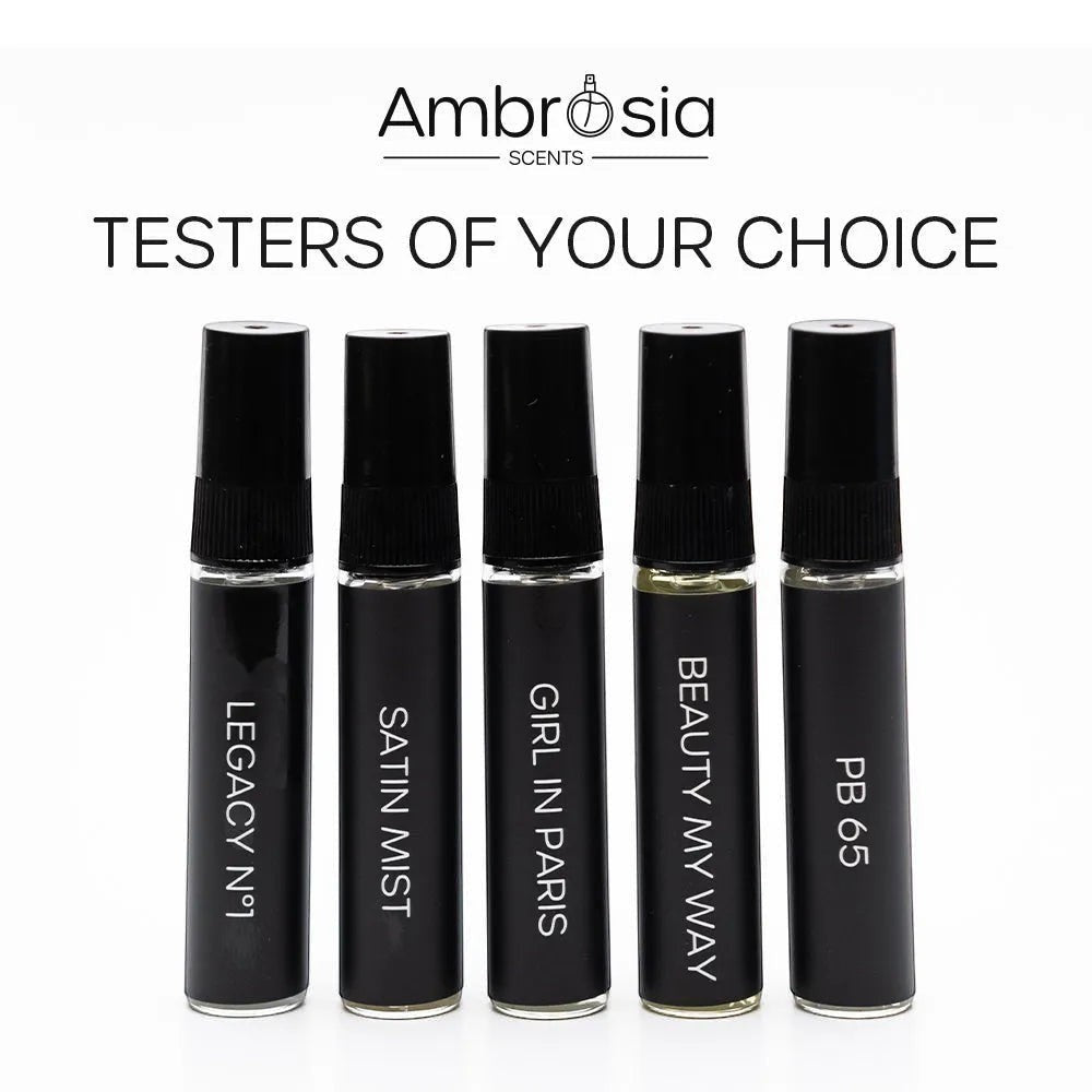 Ambrosia Scents collection of five black glass fragrance tester bottles with black caps, each labeled with a unique scent name.