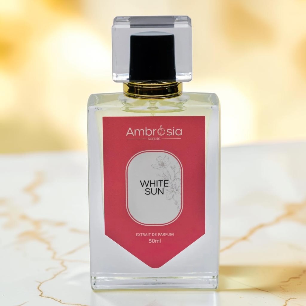 Ambrosia Scents White Sun Extrait De Parfum 50ml, a floral and warm fragrance in a clear glass bottle with a pink label.